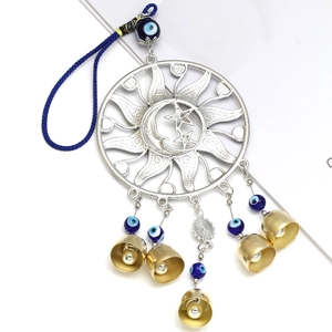 Golden sun and moon bell ornament with blue evil eye beads for car or home decor