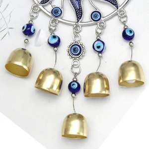 Silver Evil Eye wall hanging ornament with golden bells and blue glass beads decor