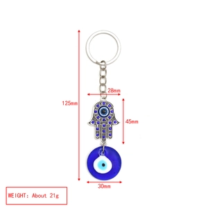 Detail showing 125mm Hamsa Hand keychain with blue crystal and 30mm glass evil eye charm