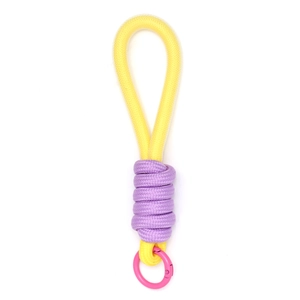 Detail of yellow and purple woven lanyard with pink metal ring for phone or bag charm