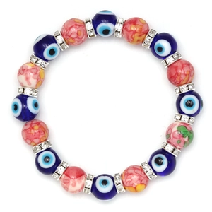Macro shot of evil eye beads with marble texture spheres and rhinestone spacers