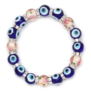 Detailed shot of blue evil eye beads with rose patterns and sparkling crystal spacers