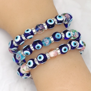 Handcrafted Evil Eye bead bracelets set with blue glass charms and rhinestone spacers