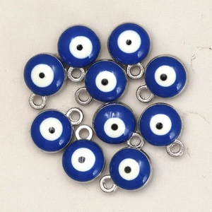 Close-up of ten blue evil eye charms with silver alloy base for DIY jewelry making