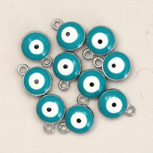 Detailed view of ten silver-plated evil eye charms with blue enamel for DIY jewelry making