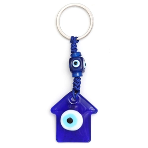 Detailed view of Turkish Evil Eye keychain with blue house pendant and woven blue cord