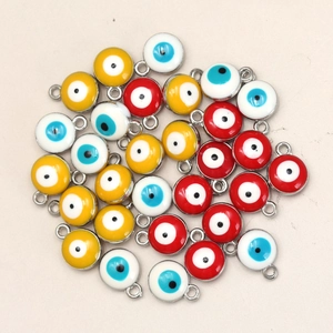 Macro detail of colorful evil eye charms with gold alloy frame and enamel inlay