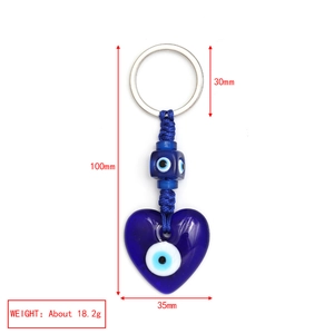 Detailed view of Turkish Evil Eye heart keychain with size dimensions and weight metrics
