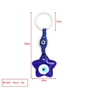 Detail view of a star-shaped blue Evil Eye keychain showing 108mm dimensions and weight