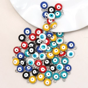 Macro shot of colorful silver-plated alloy evil eye charms for DIY necklace making