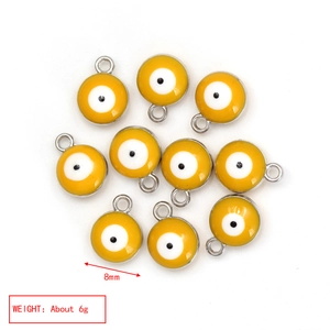 Detailed view of 8mm yellow Evil Eye enamel pendants showing dimensions and 6g weight