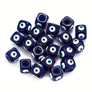 Macro shot of blue resin evil eye cube spacer beads with hole for DIY jewelry making