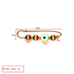 Detailed size specifications for polymer clay evil eye pin with measurement labels