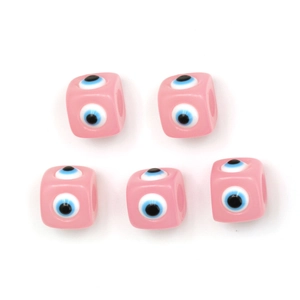 Macro detail of square pink resin evil eye beads for DIY necklace and jewelry making