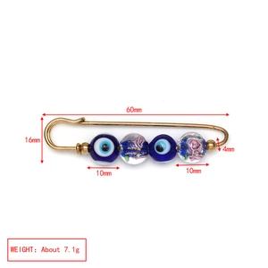 Detail view of Evil Eye safety pin brooch with blue beads and size specifications
