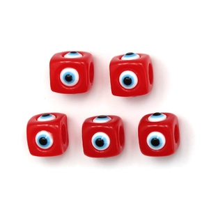 Macro detail of red cube evil eye beads for DIY necklace and bracelet jewelry making