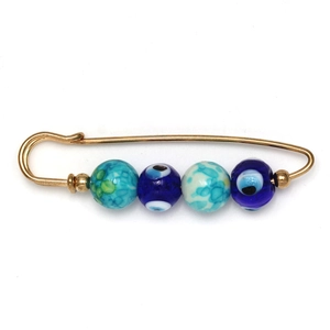 Golden evil eye safety pin brooch with blue crystal beads and bohemian style accents