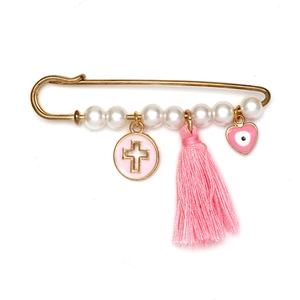 Détail d'une broche à pampilles roses avec œil porte-bonheur et croix dorée