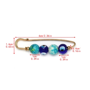 Detail view of 6cm Evil Eye brooch pin with blue crystal beads for collar decoration