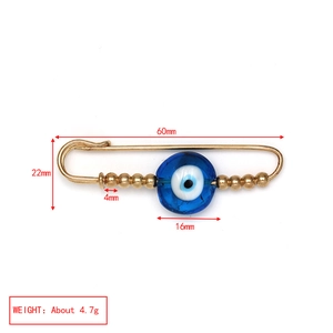 Detailed size chart of a golden evil eye safety pin brooch with blue bead and dimensions