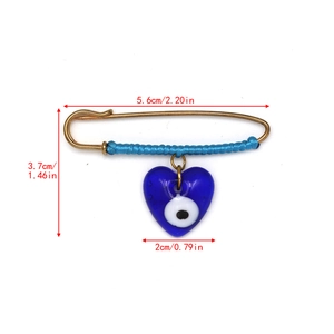 Detailed size specifications for the gold evil eye heart brooch with blue thread wrapping