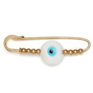 Detail of evil eye safety pin brooch with golden metal beads and blue amulet charm