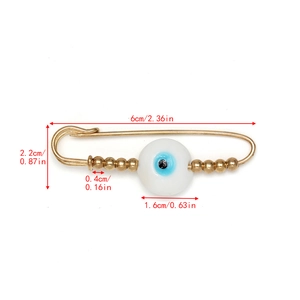Detail view showing dimensions of golden evil eye safety pin brooch with measurements