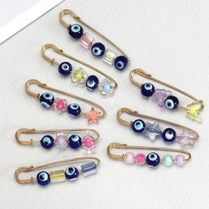 Set of 8 gold evil eye safety pin brooches with colorful candy-style acrylic beads