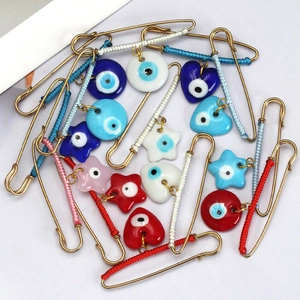 Turkish evil eye safety pin brooches set with colorful thread wrap and gold finish