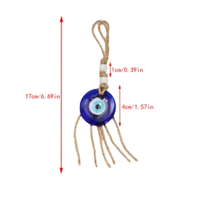 Detail view of Evil Eye charm with blue glass bead and rustic hemp rope tassel