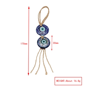 Detail view of Evil Eye pendant showing 170mm length and hemp rope tassel details