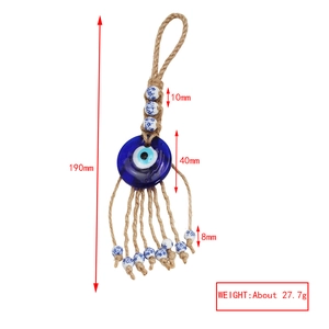Detail view of evil eye wall hanging with dimensions of 190mm length and 40mm diameter