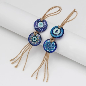 Handcrafted evil eye pendants with mandala patterns and rustic jute rope hangers