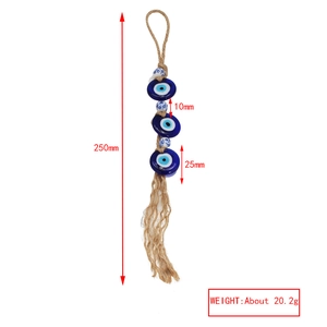 Detail view of Evil Eye amulet with blue glass beads and tassels, 250mm in length