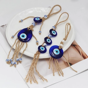 Three-piece Evil Eye rope hangers with blue glass pendants and ceramic flower beads