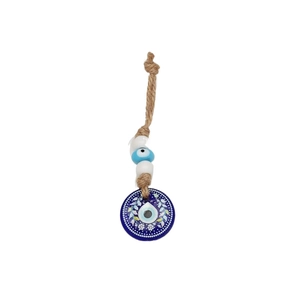 Detail of handcrafted Evil Eye keychain with blue glass pendant and braided rope