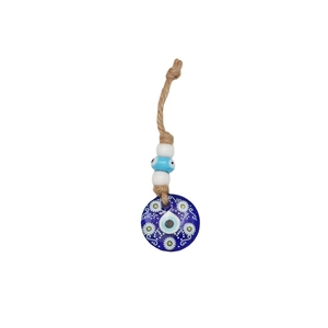 Detail of Turkish Evil Eye pendant with white daisy pattern and natural hemp rope