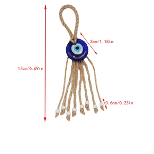 Detail view of the Evil Eye amulet showing the 17cm length and 3cm blue glass bead