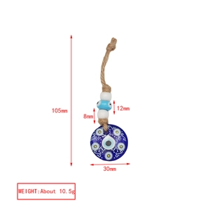Detailed dimensions of blue evil eye charm with floral patterns and rope cord