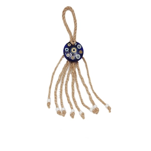 Detail of handcrafted Evil Eye wall hanging with natural hemp rope and blue glass bead