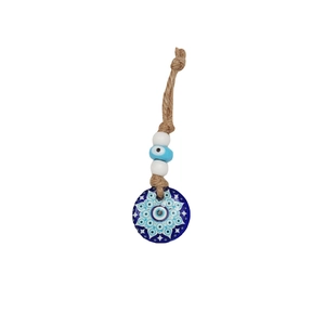Macro detail of Turkish Evil Eye keychain with braided jute rope and glass eye charm