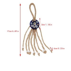 Detailed view of the 17cm evil eye pendant with braided rope and white bead tassels