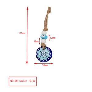 Detailed view of the Evil Eye keychain dimensions with mandala pattern and hemp rope strap
