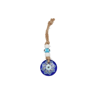 Detailed macro view of the blue glass evil eye nazar charm with natural jute rope