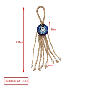 Blue glass evil eye pendant with natural hemp rope showing size specifications and dimensions