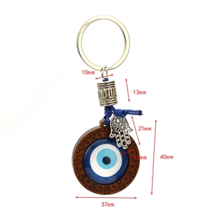 Lucky Evil Eye and Hamsa Hand keychain with blue glass beads and wood frame