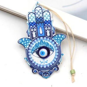 Detailed close-up of a blue Hamsa hand keychain featuring the Tree of Life and Evil Eye charm