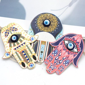 Detailed view of three Hamsa wooden keychains with colorful mandala Evil Eye patterns