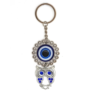 Silver alloy owl keychain with blue evil eye charm and sparkling crystal accents