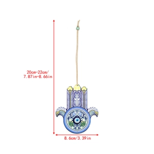 Detailed view of the Hamsa Hand Evil Eye wall hanging with size measurements in cm and inches